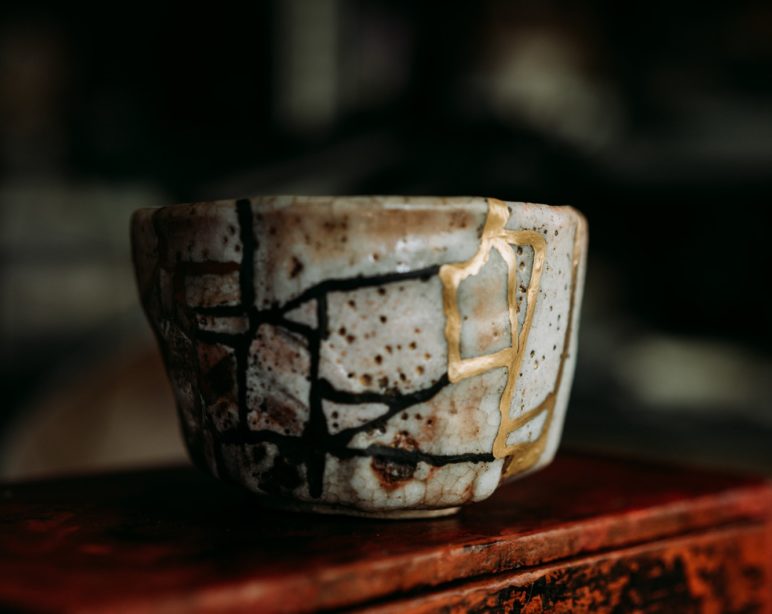 white and blue floral ceramic cup